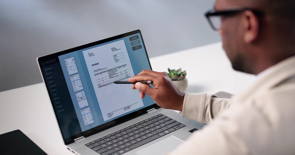 Busy Accountant Uses Invoice Software To Calculate Taxes For Clients